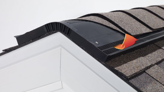 Owens Corning ridge vent installed on a roof, showcasing the shingle ridge vent system and its integration with the Owens Corning total protection roofing system. Balanced attic ventilation needs proper intake ventilation and exhaust ventilation