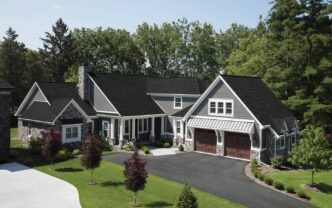 Owens Corning Duration FLEX Onyx Black shingles on a home. The asphalt shingles provide a durable and weather-resistant roofing solution for the house.