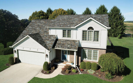 Owens Corning Duration FLEX Shingles in Storm Cloud color on a home. Durable roofing with enhanced flexibility for lasting protection and curb appeal.