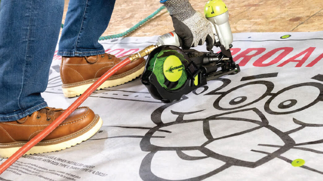 Installing Owens Corning Shingles ProArmor underlayment with a nail gun. Close-up of roofing installation, showing the ProArmor logo. Durable and reliable.
