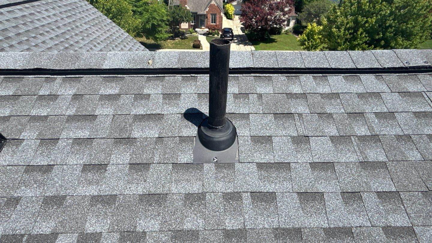 Gray asphalt shingle roof in Dearborn with a black plumbing pipe vent and new GAF Timberline HDZ shingles installed.