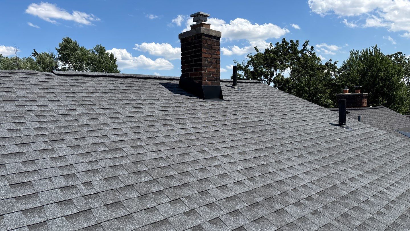 Newly installed gray GAF Timberline HDZ asphalt shingles on a Dearborn residential roof.