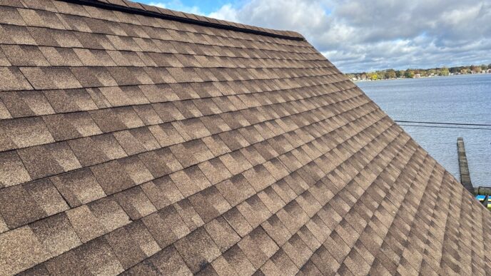 Whitmore Lake shingles on ridge of home's roof after roof replacement