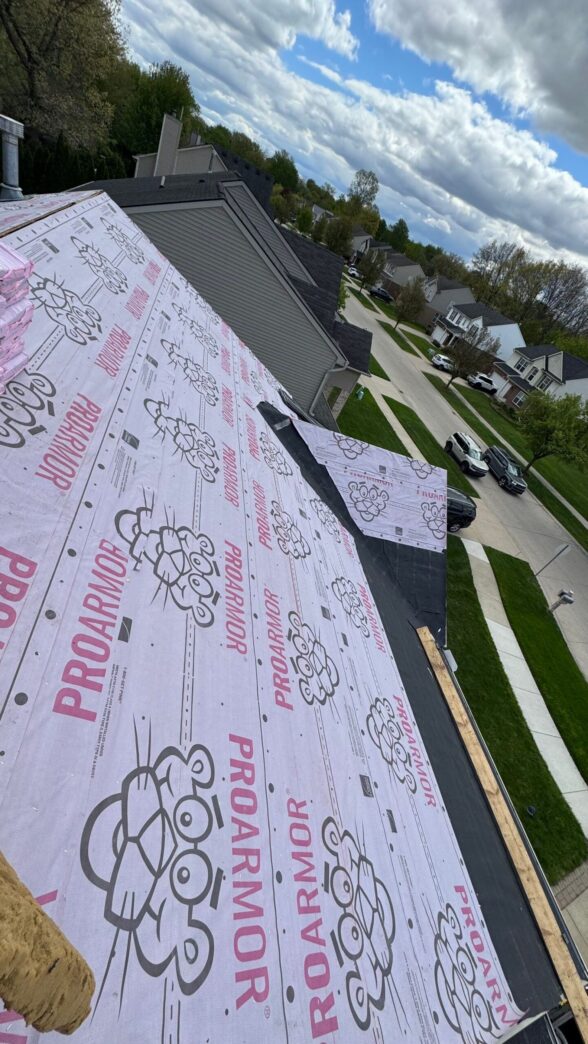 Roof under construction with ProArmor underlayment installed on a suburban house