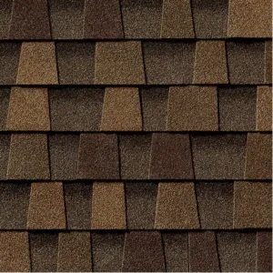 Timberline HDZ Chestnut Valley Shingles: a close-up of a roof with brown and dark brown asphalt shingles in a staggered pattern, showcasing texture and color.