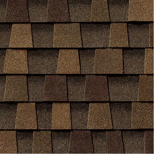 Timberline HDZ Chestnut Valley Shingles: a close-up of a roof with brown and dark brown asphalt shingles in a staggered pattern, showcasing texture and color.