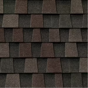Close-up of Timberline HDZ Midnight Mesa shingles. Roofing material with a mix of dark brown, gray, and black tones. Durable and aesthetically pleasing.