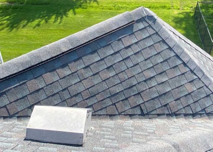 New Baltimore roof replacement: A valley after roof replacement, showcasing clean lines, proper shingle alignment, and a watertight seal. 
