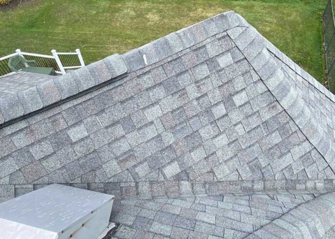 Before New Baltimore roof replacement: showing the roof valley with old, worn shingles needing replacement. Professional roofing services are essential.